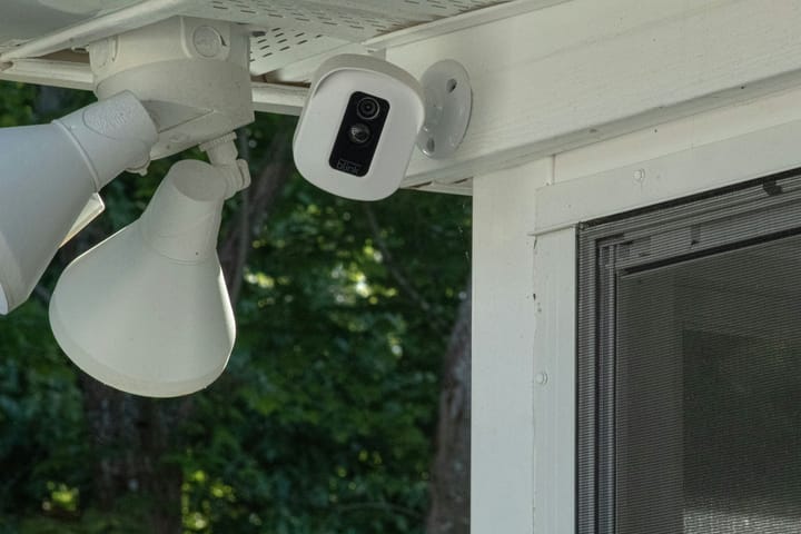 Outdoor security camera mounted on a wall